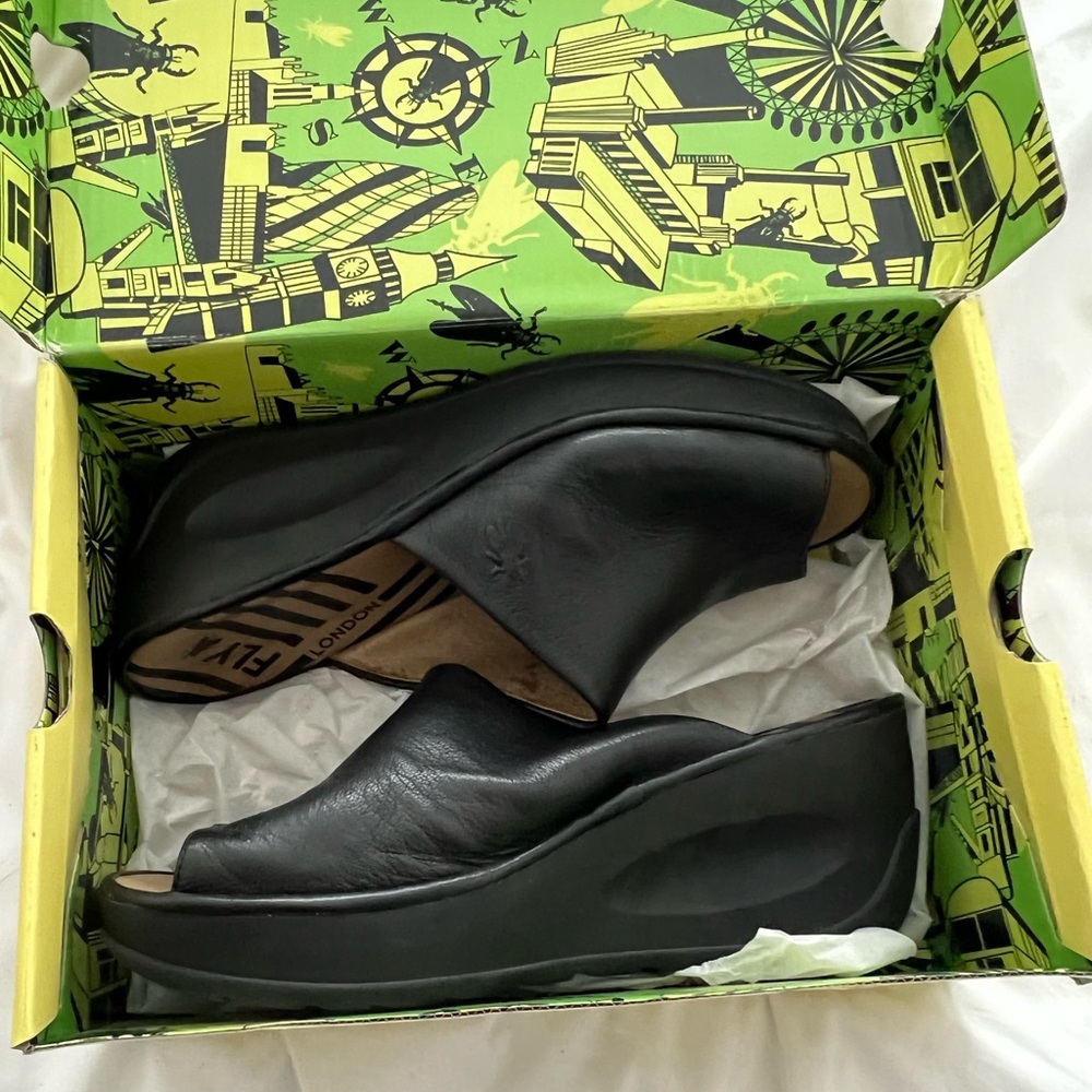 Fly London Black slides size 42 (fits US10 women). In very good condition.